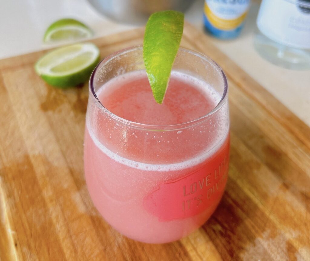 Refreshing Guava Fresca Mexican drink with tequila in a glass with ice