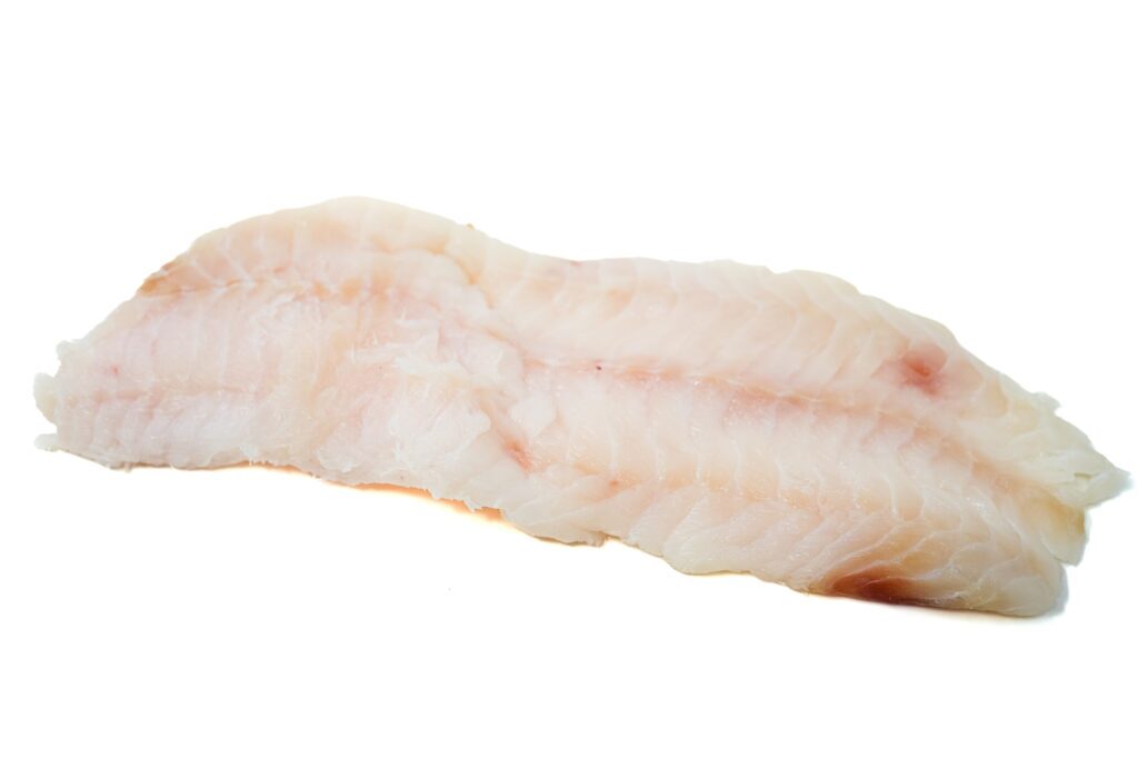 Raw cusk fish fillet on a white background, showcasing its firm texture and mild pink hue